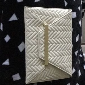 Clutch style purse with strap